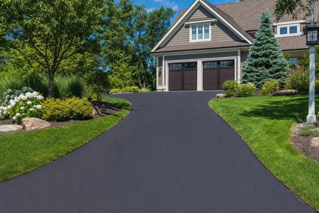 Freshly paved smooth black asphalt driveway at a residential home