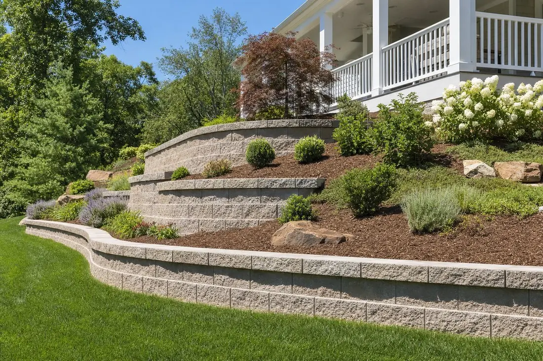 Tiered segmental block retaining wall on a landscaped slope