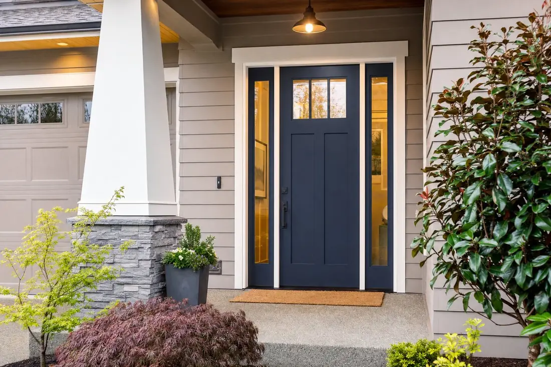 New navy blue craftsman-style front door on a home